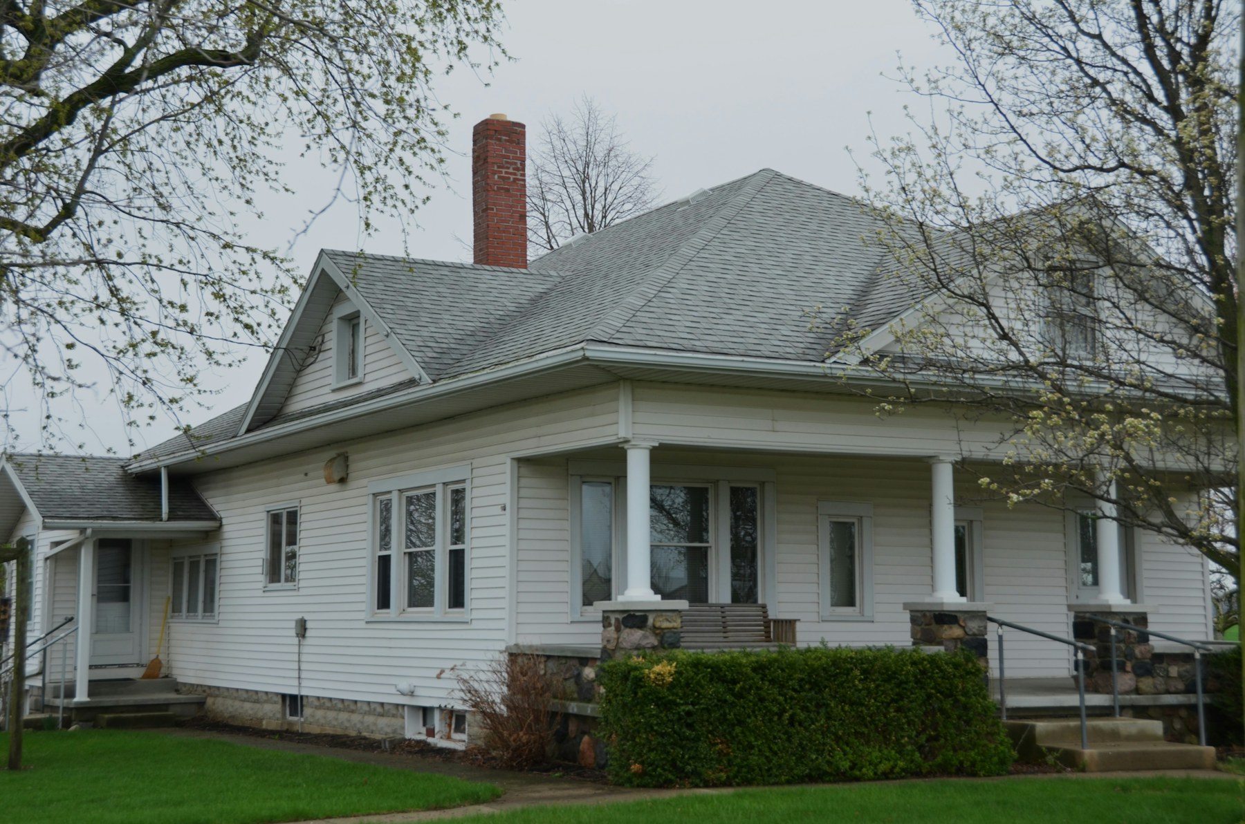 A white house with a covered front porch